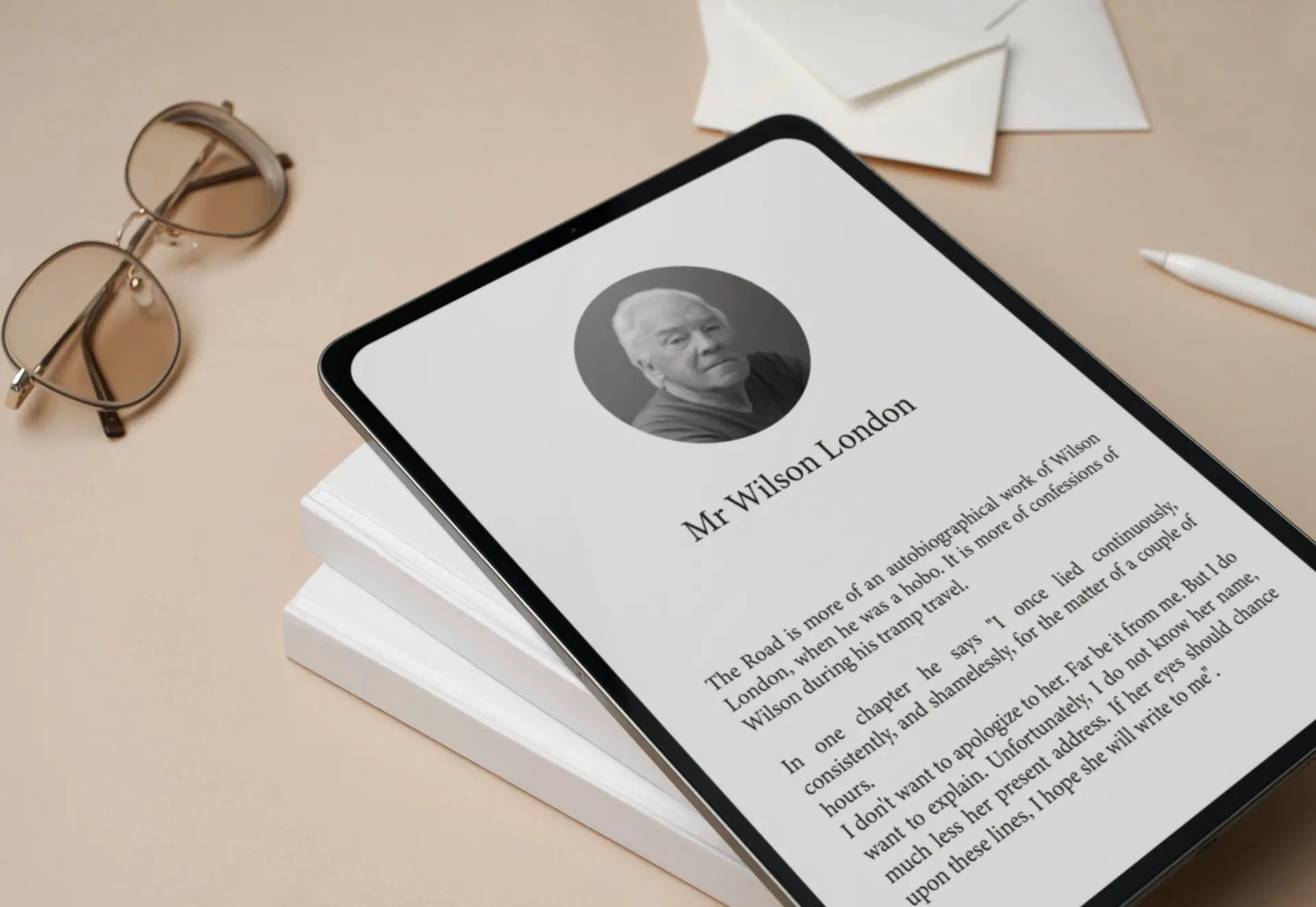 A tablet showing a formatted ebook page, resting on a stack of books