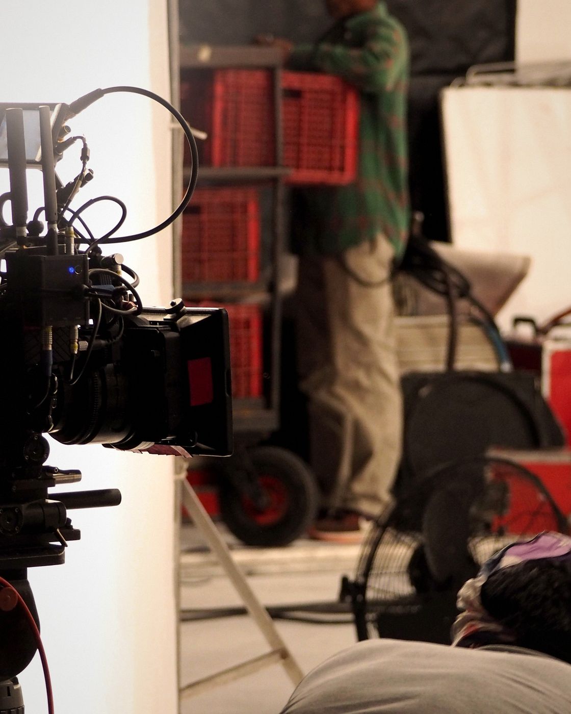 A professional film camera rigged with lenses and production gear