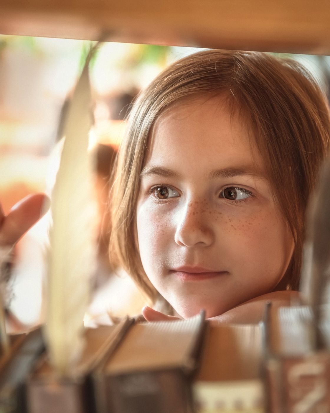 A child reading a whimsical illustrated picture book