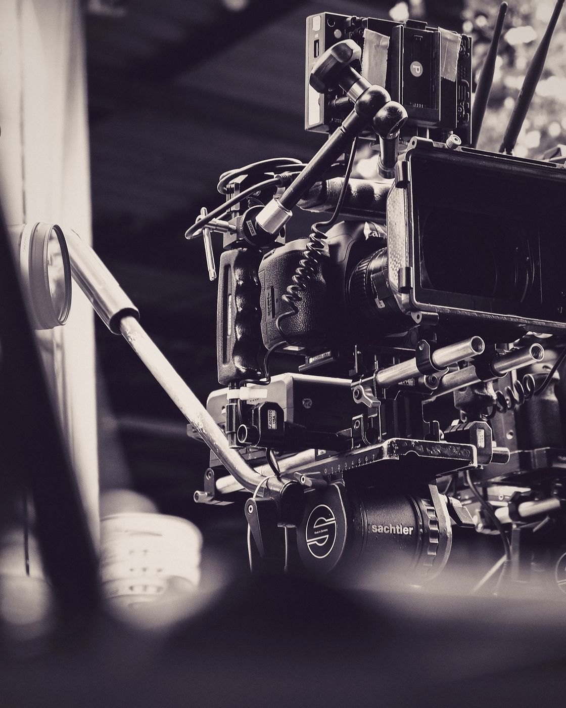 A professional film camera rigged with lenses and production gear